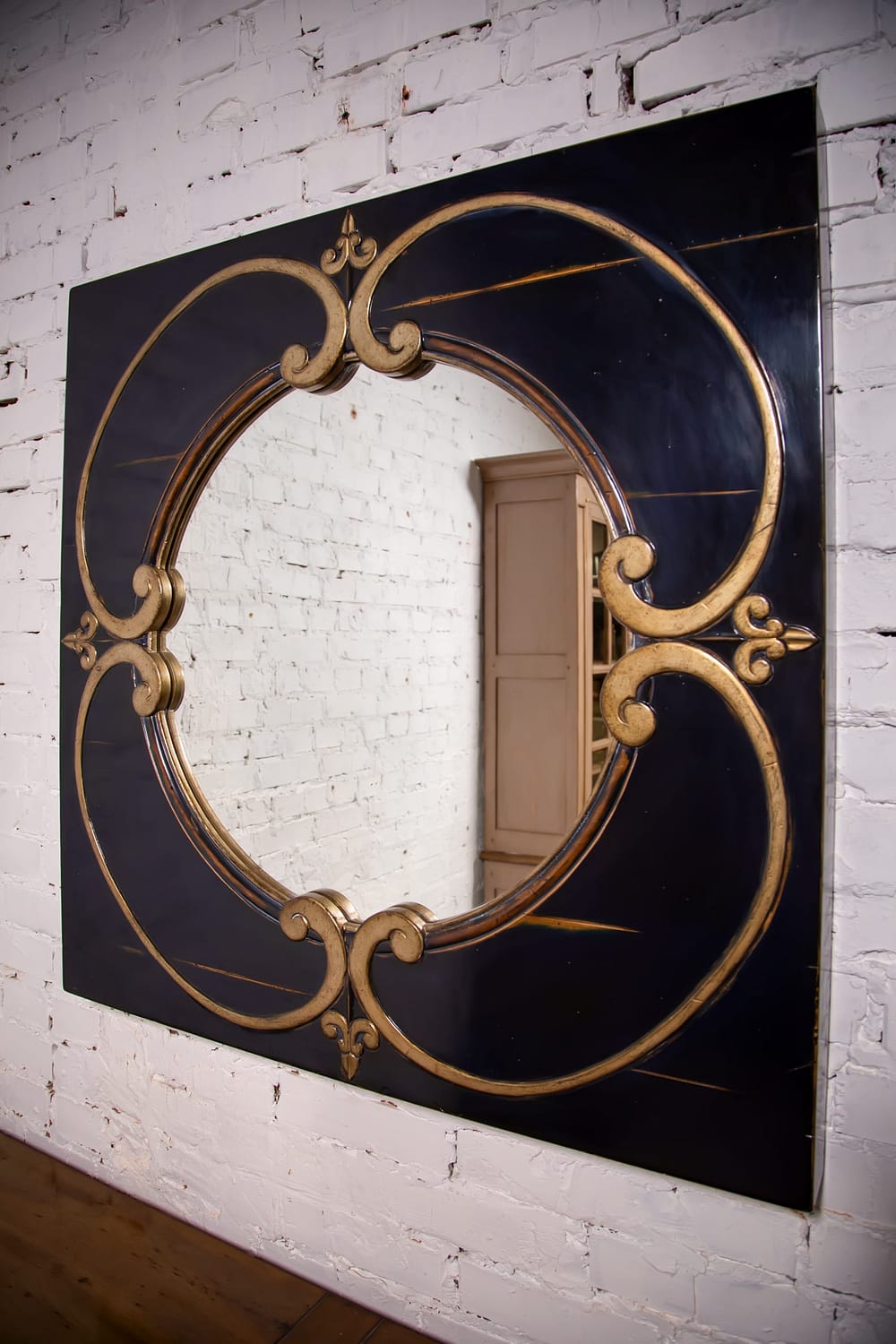 round mirror in a wooden frame in the vintage style