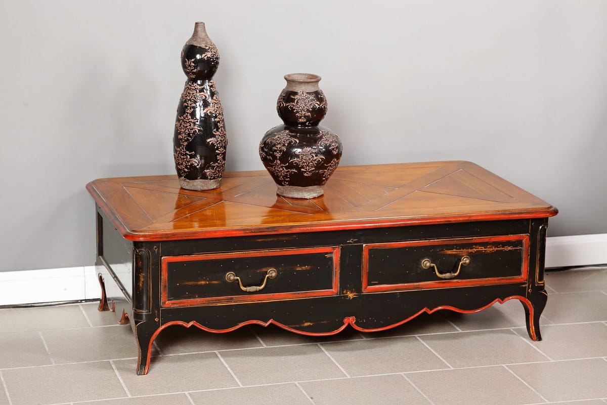 an old solid wood coffee table in the style of the Regency era