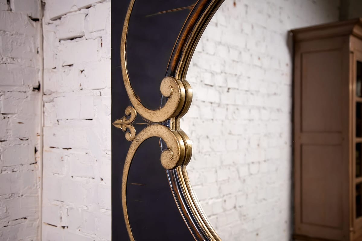 round mirror in a wooden frame in the vintage style