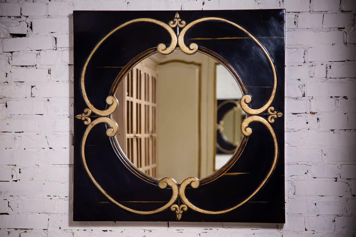 round mirror in a wooden frame in the vintage style